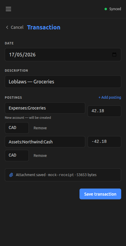 TransactionForm pre-populated with extracted draft and the Attachment saved indicator